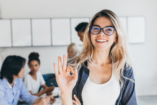 close-up-portrait-pretty-female-manager-from-sales-department-indoor-photo-smiling-woman-working-office-with-discussing-people.jpg