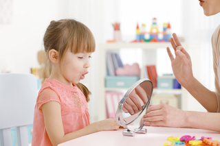 cute-little-girl-speech-therapist-office.jpg